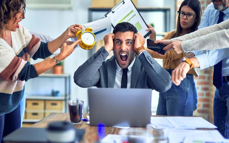 Group of business workers working together. Partners stressing o